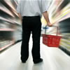 Man with a basket in a supermarket